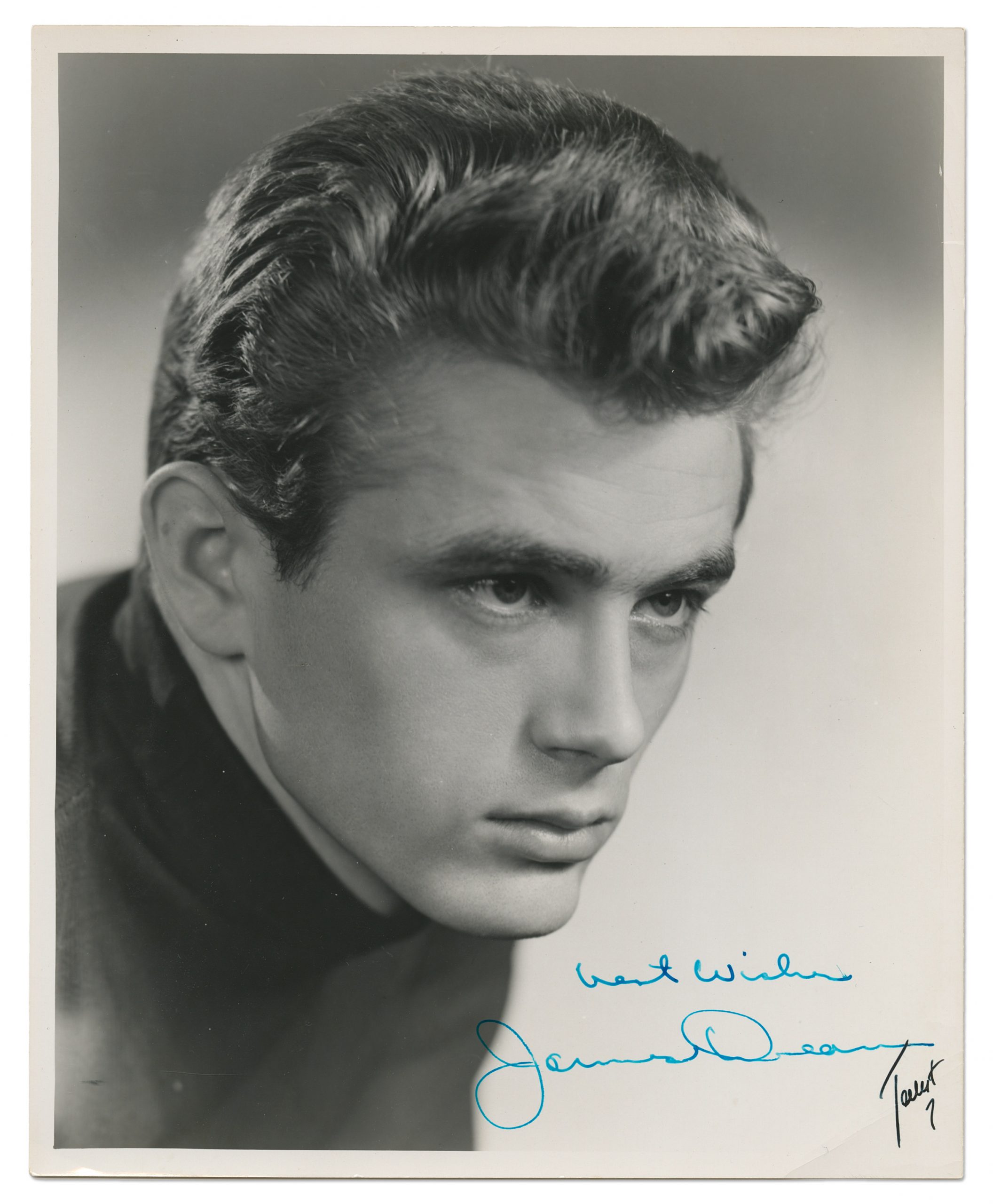 James Dean signed headshot contrasted in blue pen. Sold at auction for $15,101