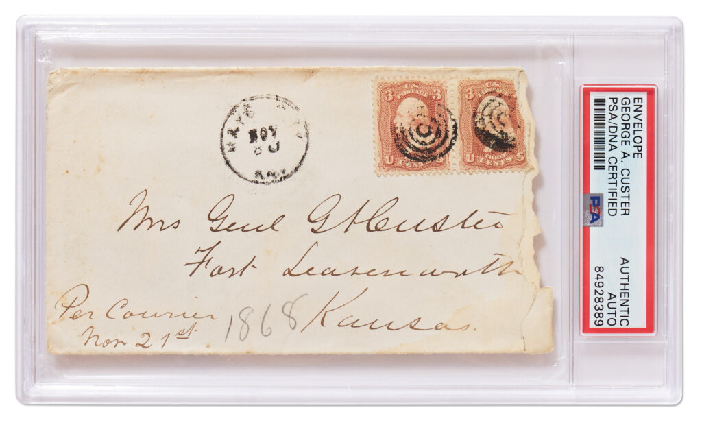 Handwritten envelope to “Mrs Genl GA Custer" with two cancelled stamps in the upper right corner. Slabbed by PSA.