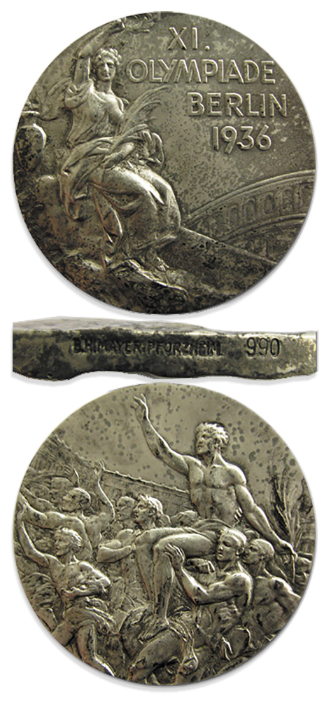 Silver medal front features goddess of victory holding a winner's crown paired with the text ''XI Olympiad Berlin 1936''. The reverse pictures an Olympic winner being carried by a crowd.