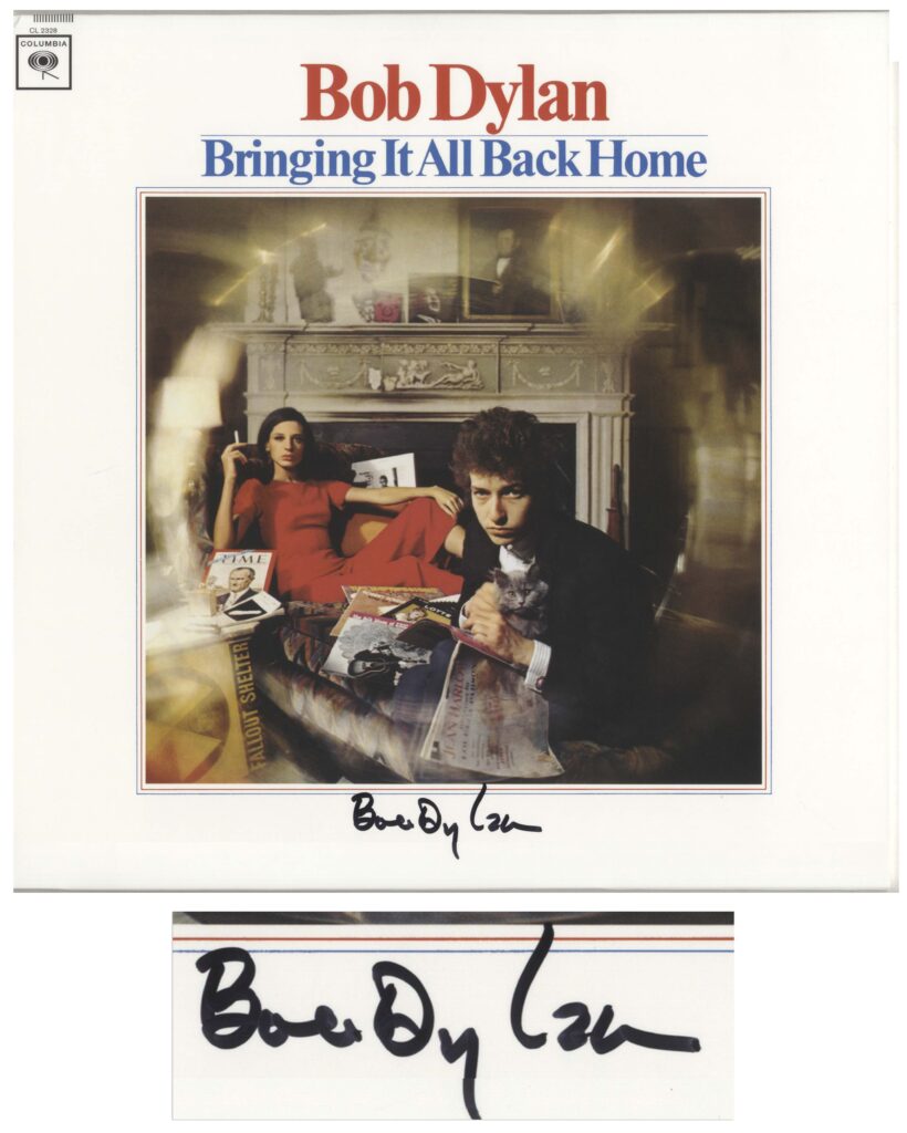 Color image of Bob Dylan and a woman wearing a red dress with a cigarette lounging behind him. Dylan signs along bottom.