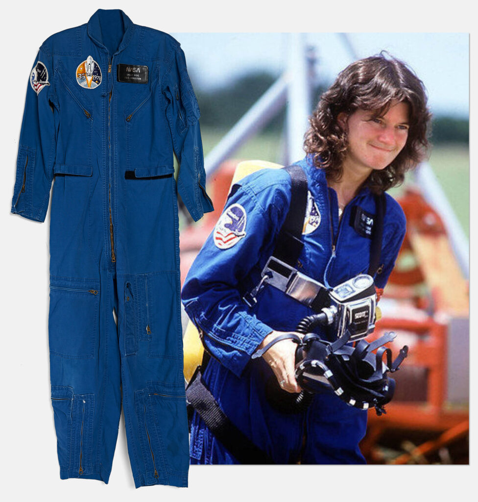 Dark blue coveralls with an STS-2 patch on right arm and a black NASA patch on the left breast. Ride wearing the coveralls also appears next to a full length image of coveralls alone